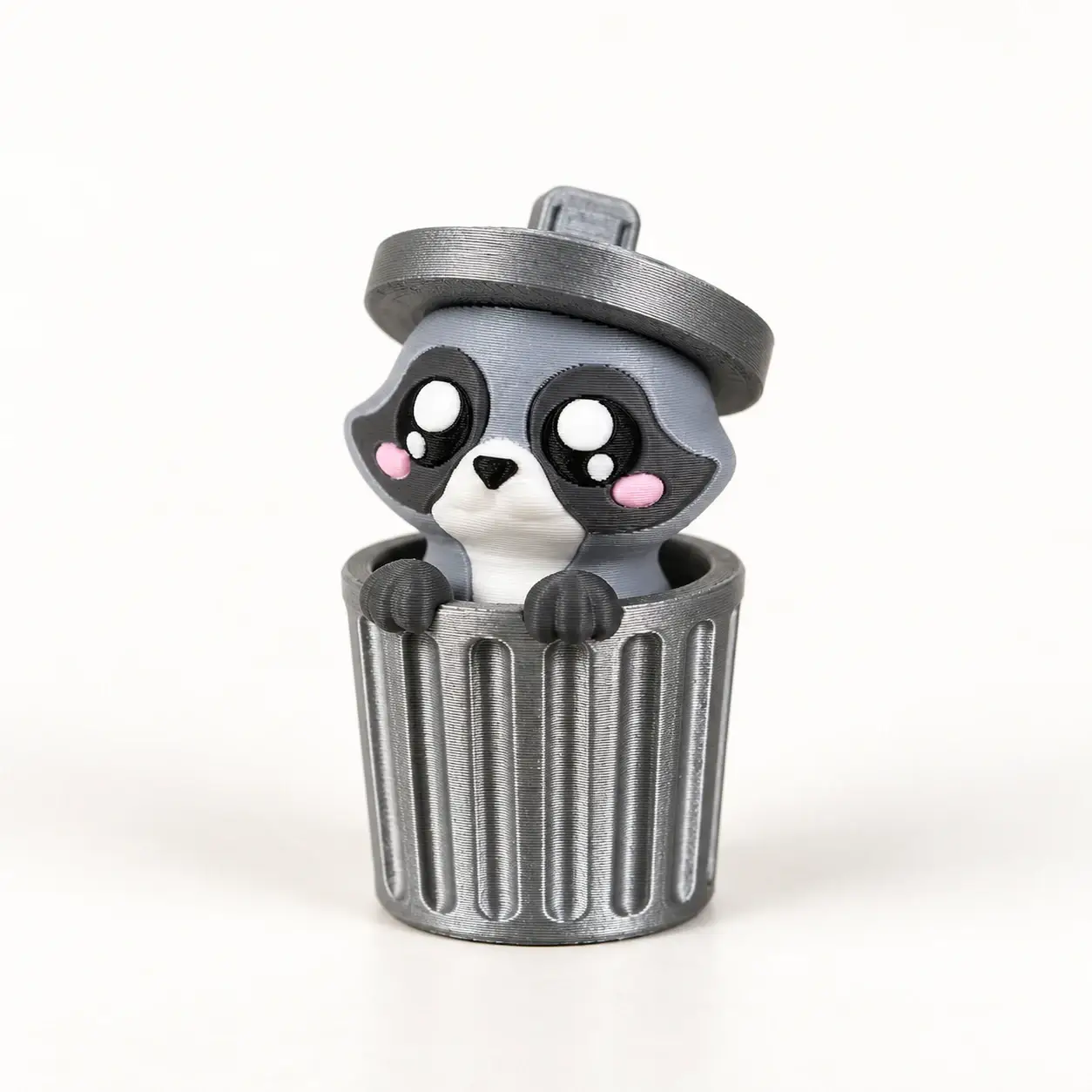 Trash Can Animal Clickers, Raccoon, a small printed item in the pictured colors