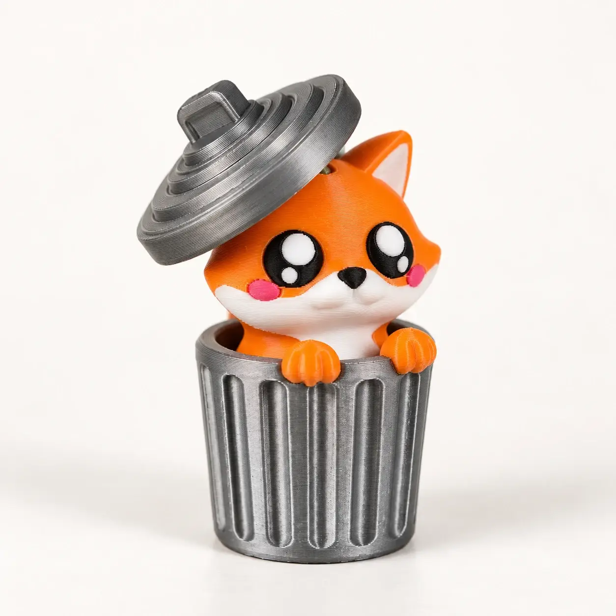 Trash Can Animal Clickers, Fox, a small printed item in the pictured colors