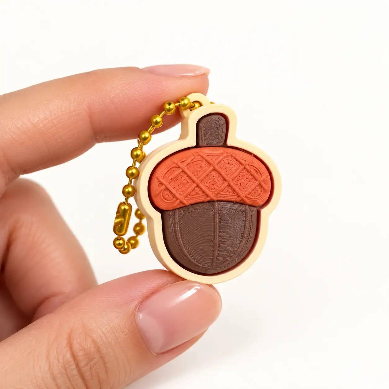 Forest Clickers, Acorn, a small printed item in the pictured colors
