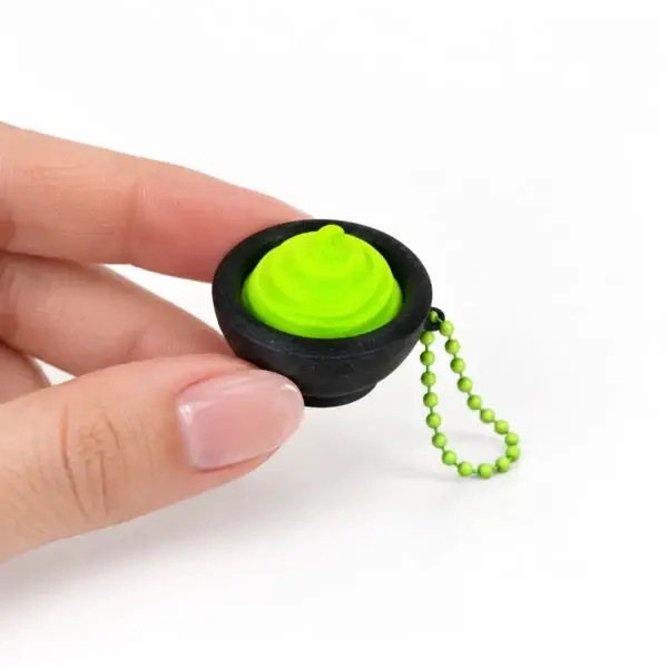 Wasabi Clicker, Black bowl, a small printed item in the pictured colors