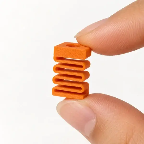 Silent Dummy Clicker Insert, Orange insert, a small printed item in the pictured colors