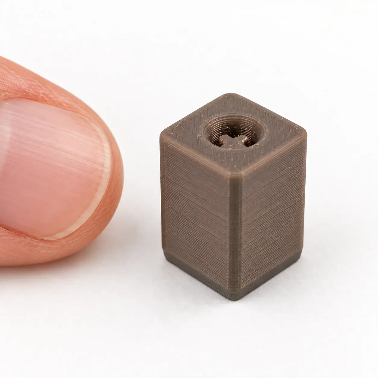Clicker Keychain Adapter, Gray rigid adapter, a small printed item in the pictured colors