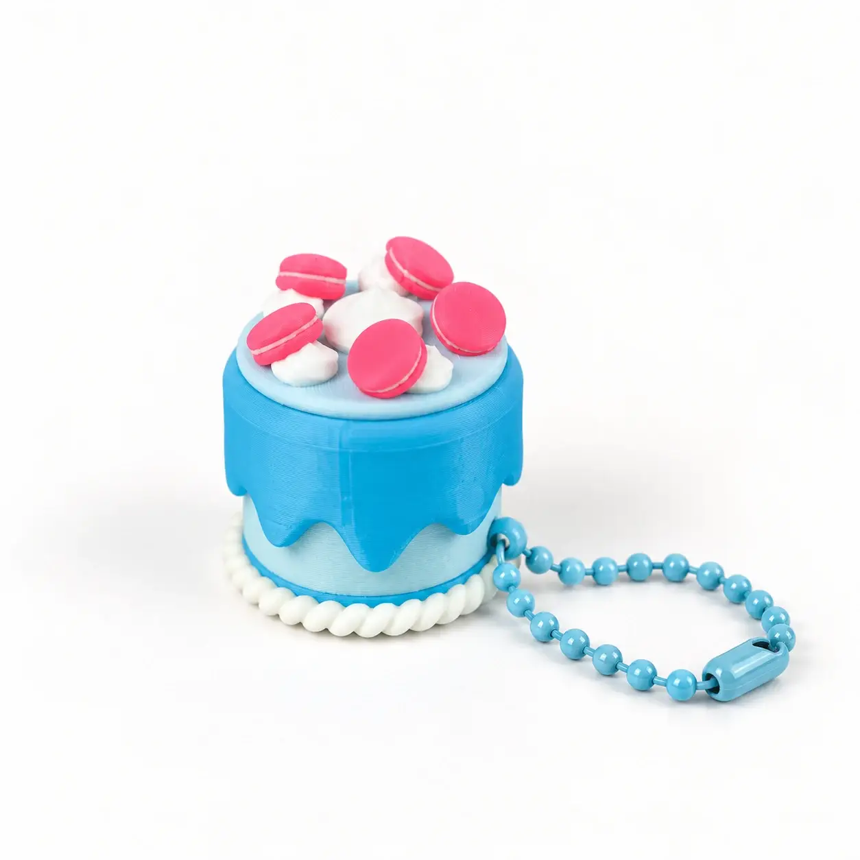 Cake Slice Clickers, Blue macaron cake, a small printed item in the pictured colors