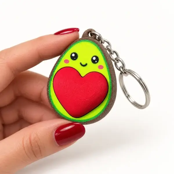 Heart Avocado Clicker, Red heart avocado, a small printed item in the pictured colors