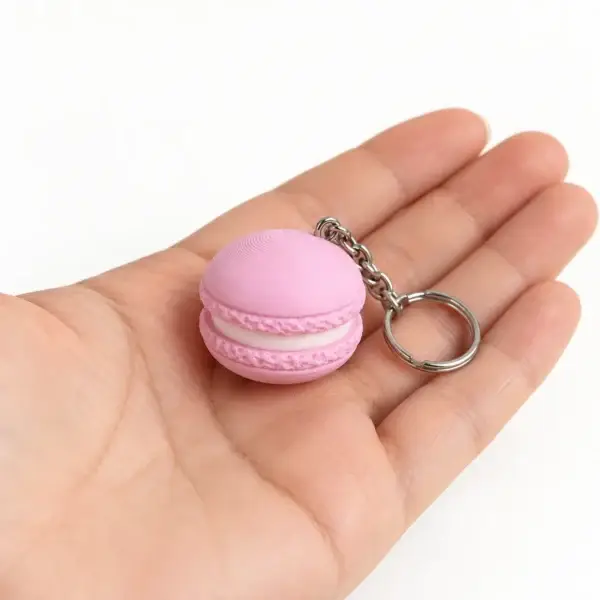 Macaron Clicker, Pink, a small printed item in the pictured colors