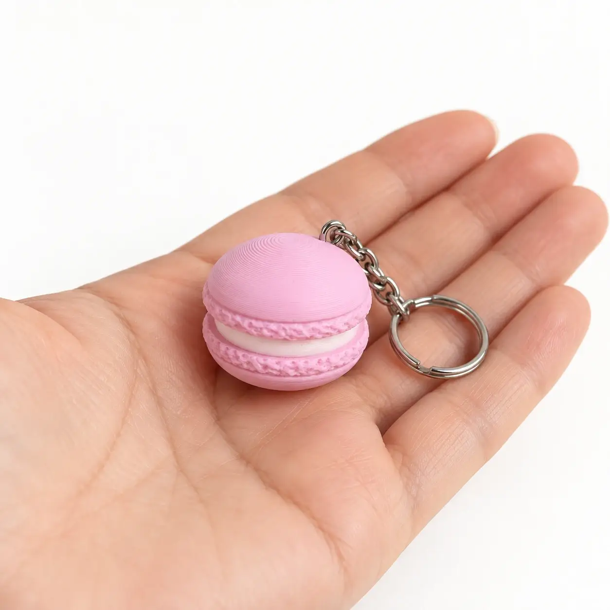 Macaron Clicker, Pink, a small printed item in the pictured colors