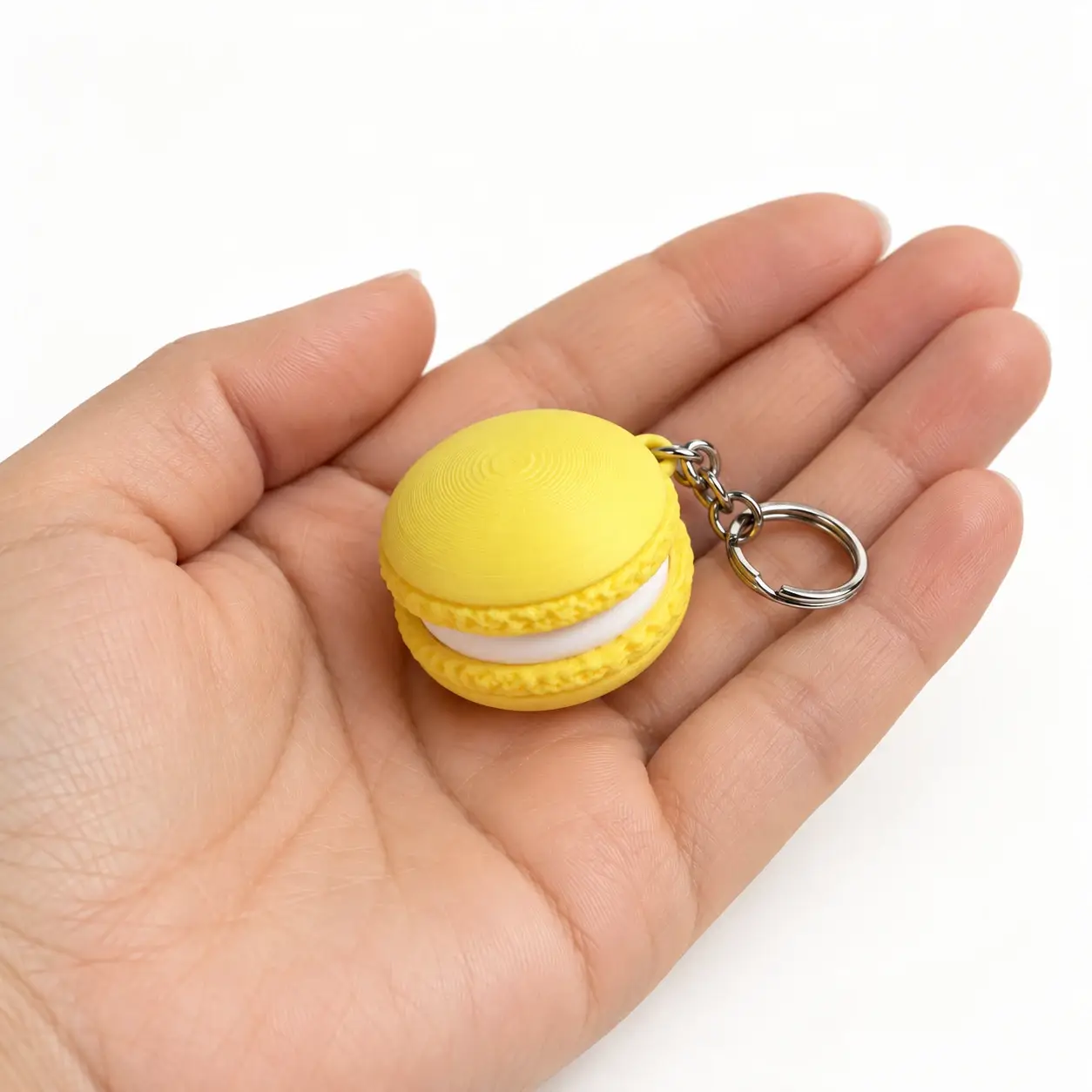 Macaron Clicker, Yellow, a small printed item in the pictured colors