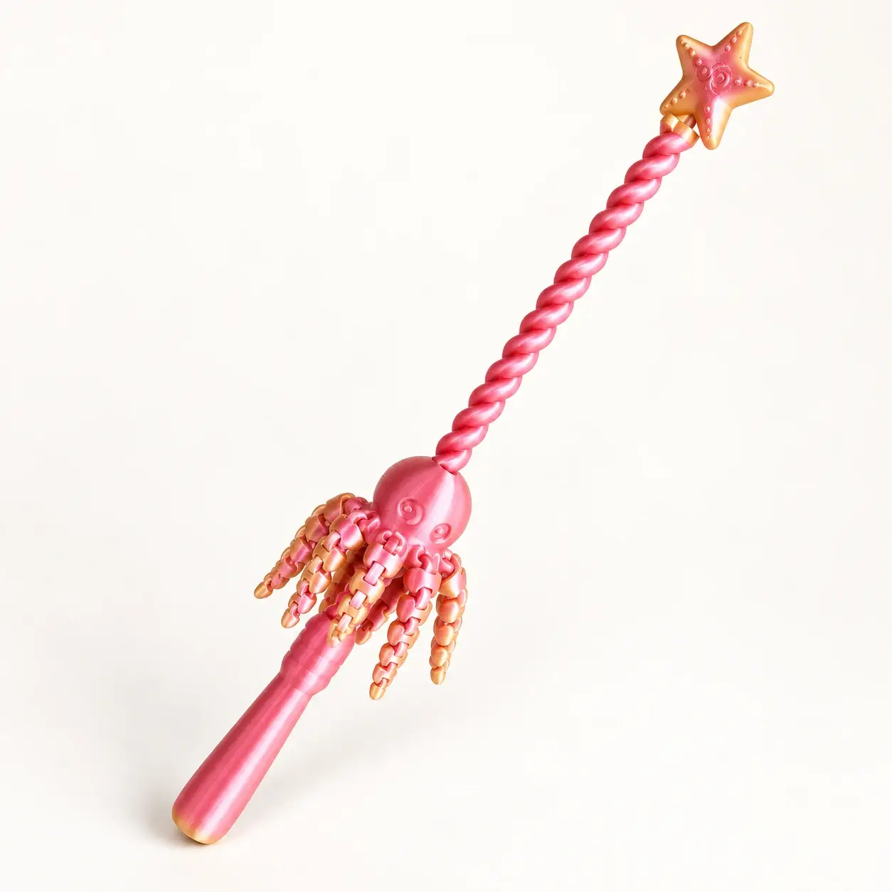 Pink and gold octopus wand with pink spiral and handle