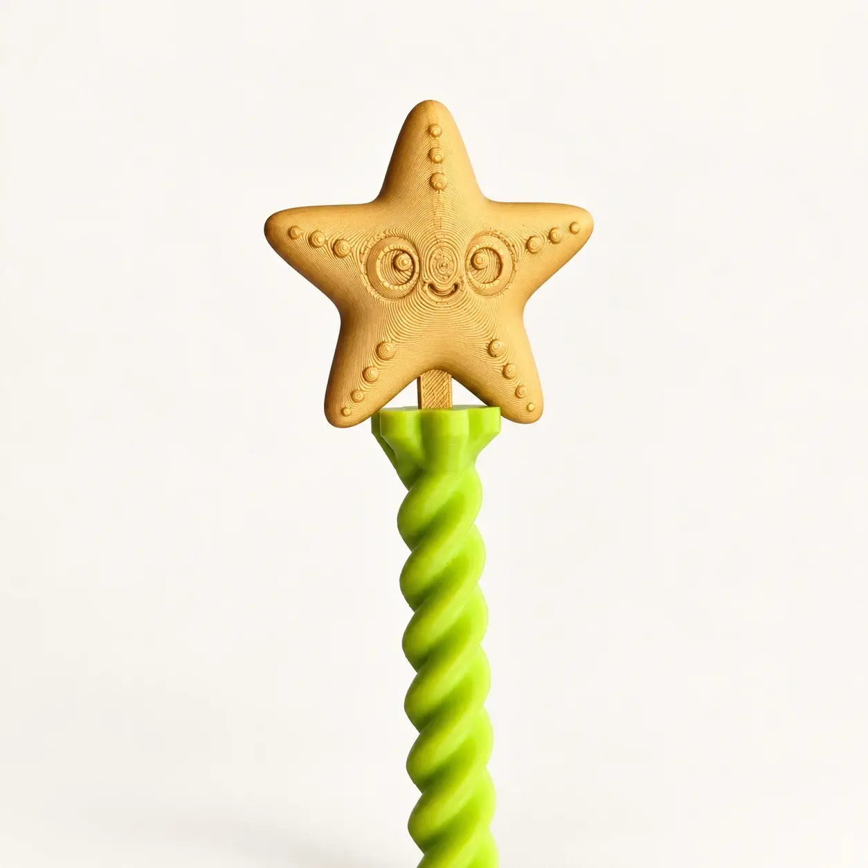 Gold smiling star and lime green spiral detail